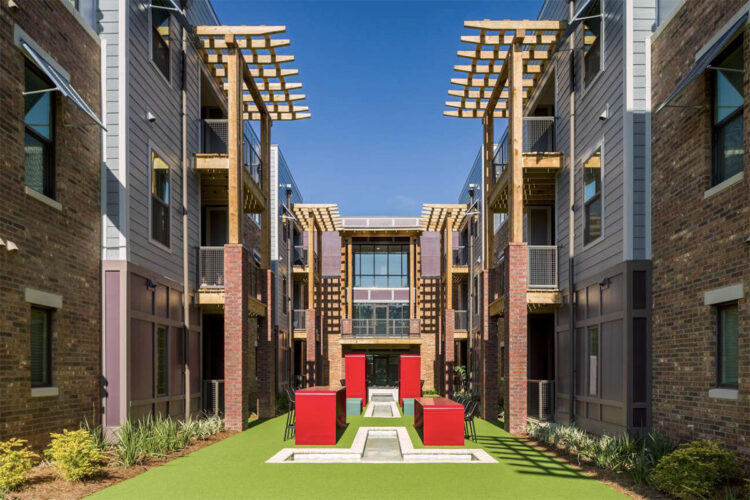 Outdoor lounge with large red tables