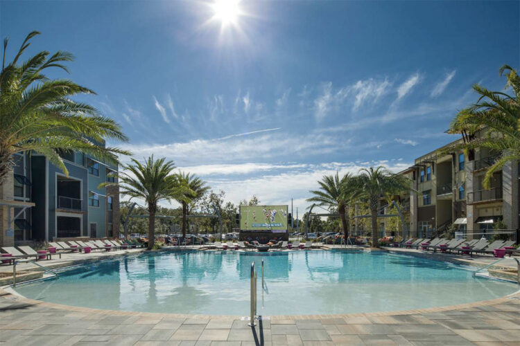 Resort style pool surrounded by lounge chairs