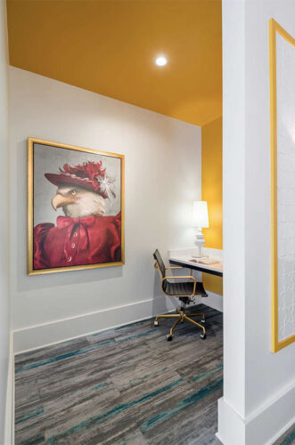 Study nook decorated with a yellow accent wall